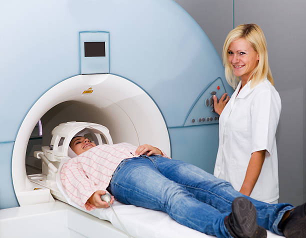 istock Young girl in CAT scan machine..technician at work 171145678