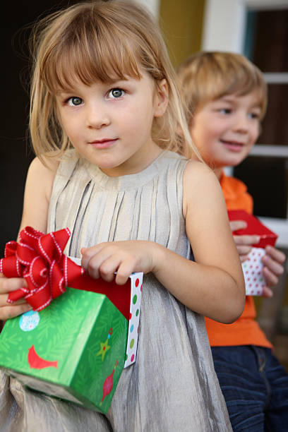 istock girl opening a gift 171145694