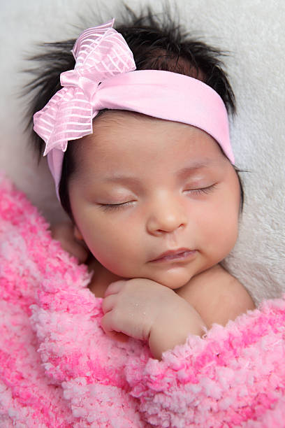 istock Newborn Baby with Pink Bow 171145868