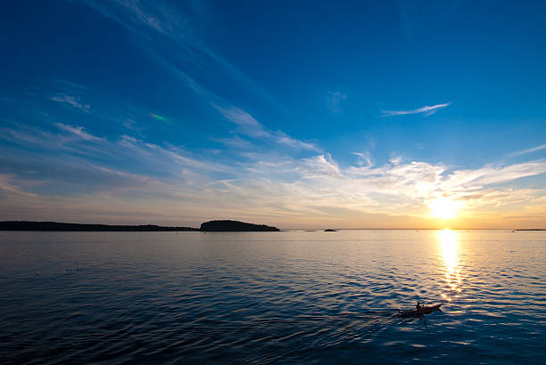 istock Silhouette of man kayaking at sunset 171146164