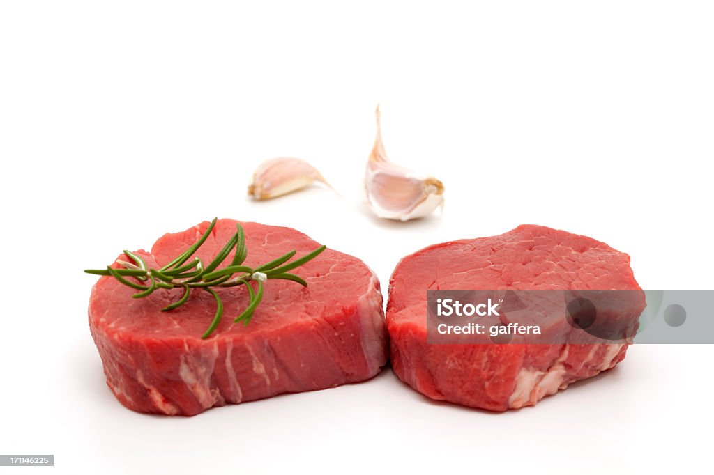 filet mignon close-up of two filet mignon with rosemary and garlic Fillet Steak Stock Photo