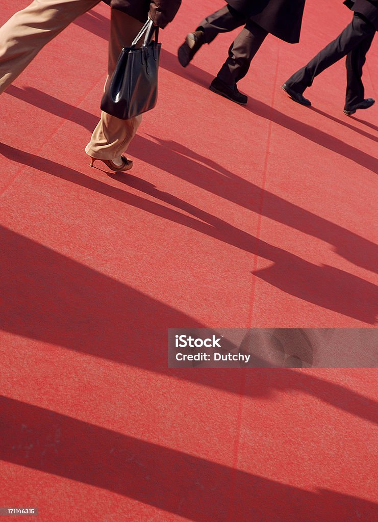 Red Carpet People walking on red carpet (put there for film premiere).View more related images in the following lightbox: Red Carpet Event Stock Photo