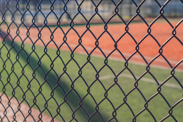 Copy space background fence in forground baseball field background stock photo