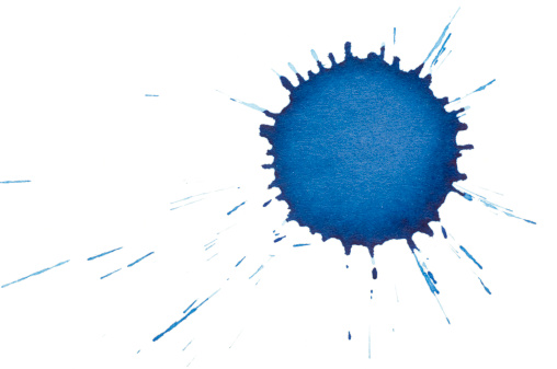 The dried splatter of a blue ink drop, isolated on white