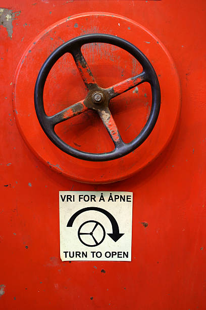 istock oil rig platform wheel handle to water tight door 171146682