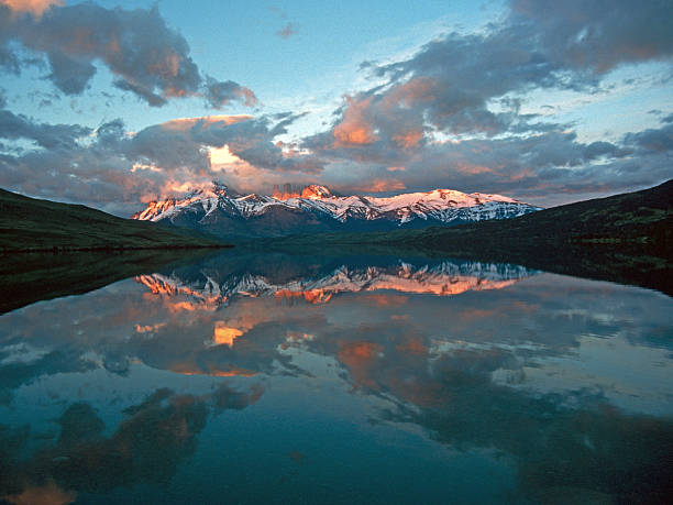 istock Clouds and mountains reflecting in the lake 171146887