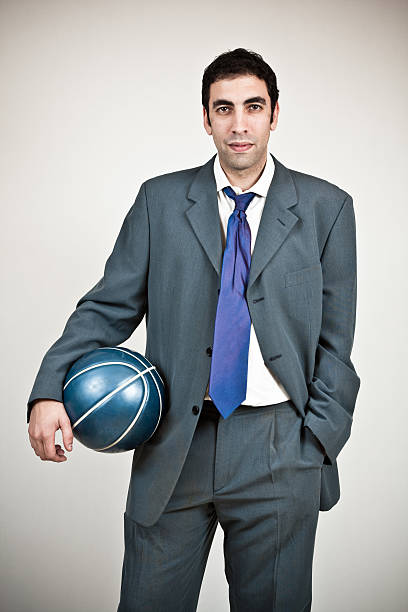 istock Businessman holding a basket ball. 171147035