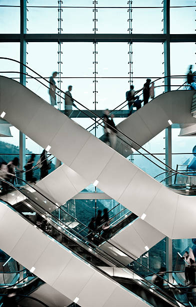 エスカレーター - escalator people city blurred motion ストックフォトと画像