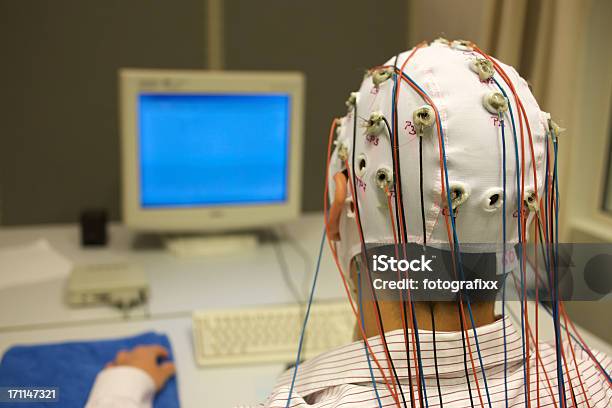 Man Connected With Cables For Eeg In Front Of Monitor Stock Photo - Download Image Now
