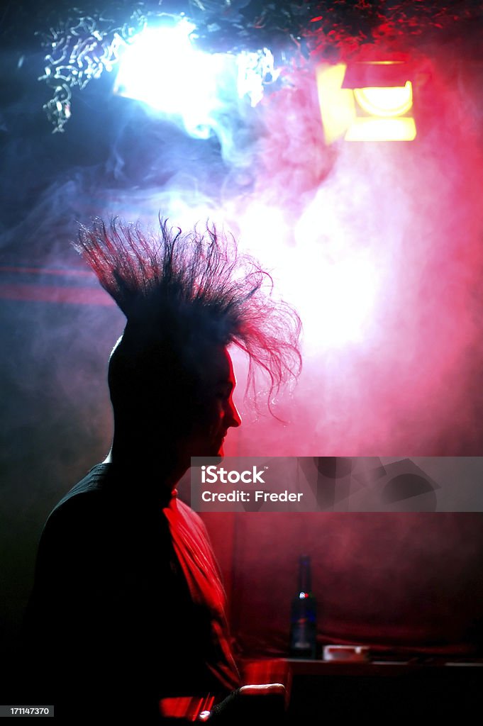 standing at the bar silhouette of a gothic/punk guy with a mohawk haircut in a discotheque 1980-1989 Stock Photo