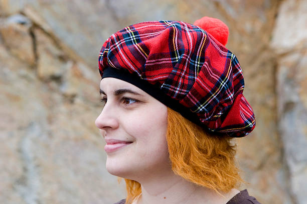 Scottish Woman A woman wearing a tam o''shanter with red hair tam o'shanter stock pictures, royalty-free photos & images