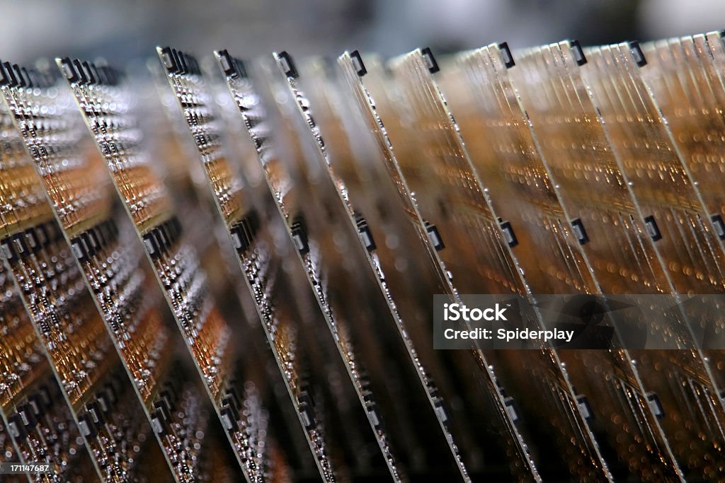 Close up of circuit boards on assembly line Electronic circuit boards stacked on an assembly line. Shot with shallow depth of field. Manufacturing Stock Photo