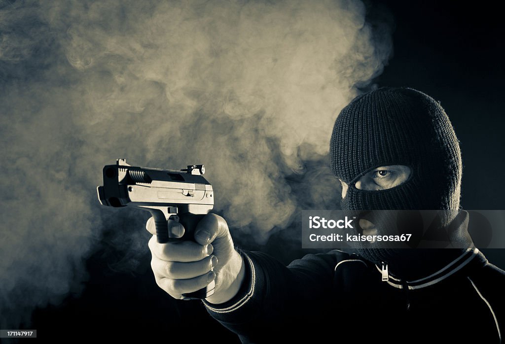 Przestępca z pistoletu - Zbiór zdjęć royalty-free (Kominiarka)