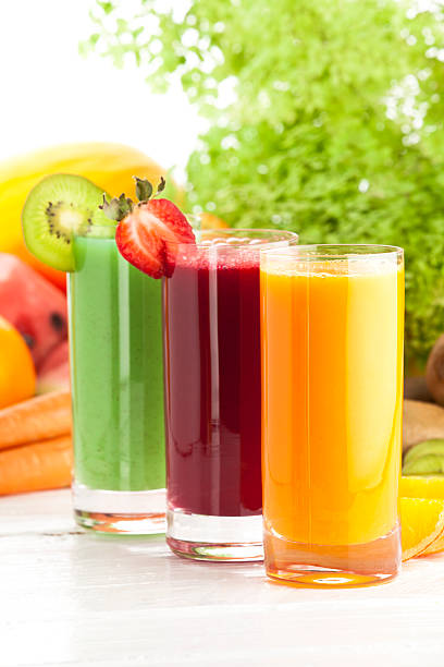 istock Three glasses of fruit juices on white garden table 171147927