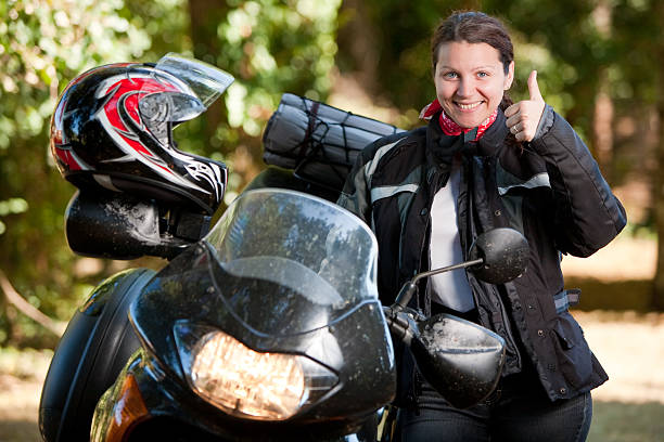 Young women ready to ride motorcycle.