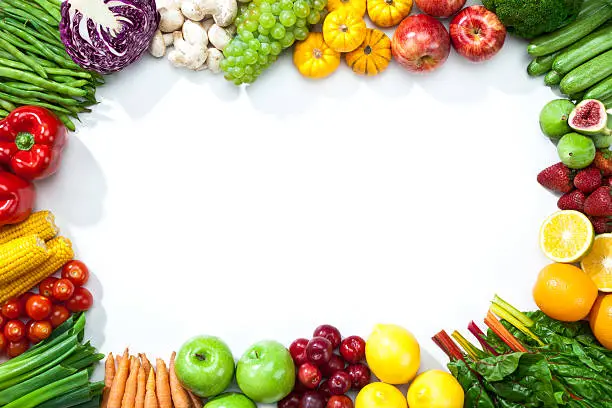 Photo of Assortment of fruits and vegetables disposed on a frame shape