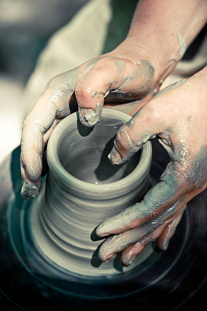 istock potter makes a jug out of clay 171148377
