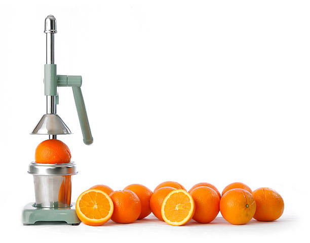 oranges and squeezer some oranges isolated on white and a manual/mechanical squezeer freshly squeezed stock pictures, royalty-free photos & images