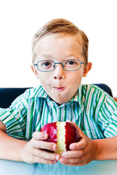 istock Little boy eating an apple 171148812
