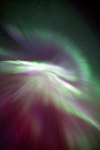 An incredible array of greens, purples and reds of a corona during an Aurora Borealis display.