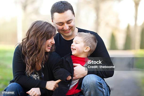 Young Family At The Park Stock Photo - Download Image Now - Affectionate, Bonding, Boys