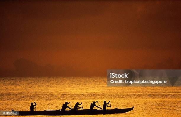Silhouette Of Rowers At Sunset In Oahu Hawaiis North Shore Stock Photo - Download Image Now