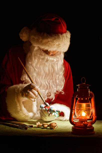 istock Santa Claus painting a toy 171149353