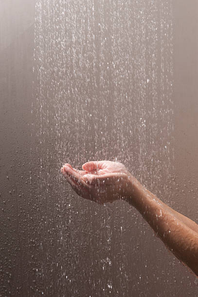 woman's arms and hands in water