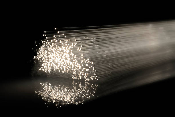 lumineux fibres lumière - photon photos et images de collection