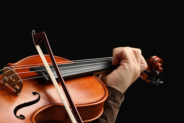 istock A close-up of a person's holding a violin 171149519