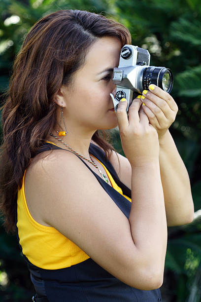 istock Woman taking a picture by using vintage camera 171149677
