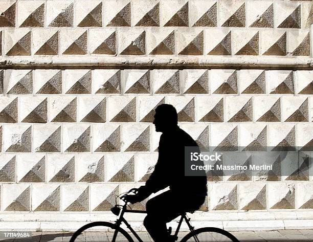 Person Riding Bicycle Stock Photo - Download Image Now - Ferrara, Palace, Street