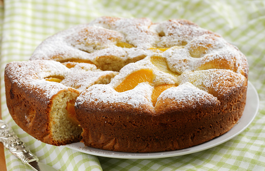 homemade pie with apricots and powdered sugar