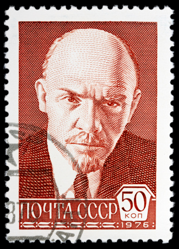 USSR postage stamp showing Vladimir Lenin. Isolated on black