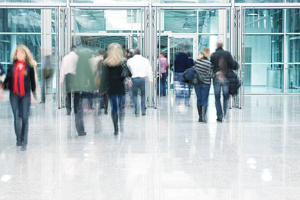 istock People Walking Through Entrance Door in Modern Building, Blurred Motion 171149856