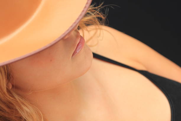 Young woman with hat on.