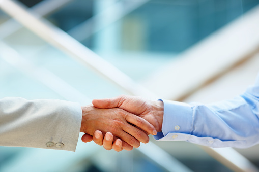 Closeup of business executives shaking hands