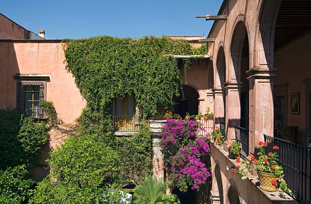 The courtyard of a colonial building from the 18th century, now a hotel in San Miguel de Allende, Mexico. San Miguel de Allende was named a Pueblo M