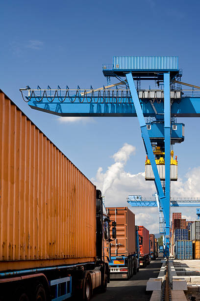 istock Cargo containers, trucks and gantry cranes 171150197