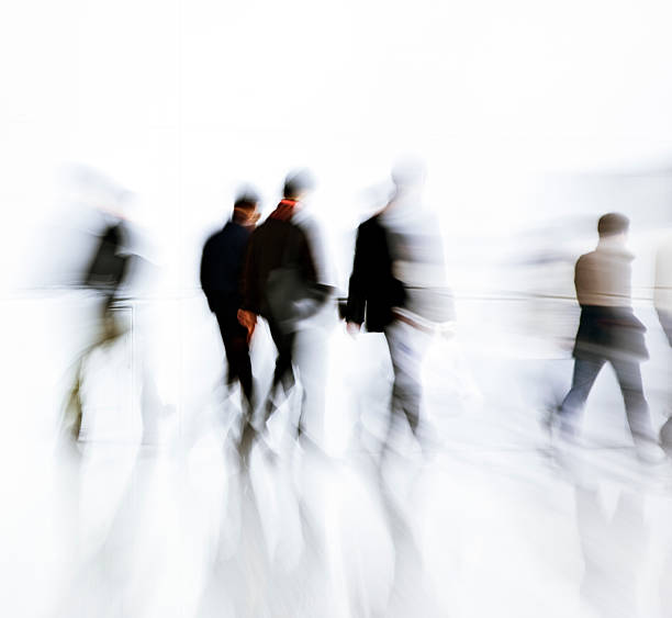 istock Group of Businessmen Walking, Blurred Motion, White Background 171150227