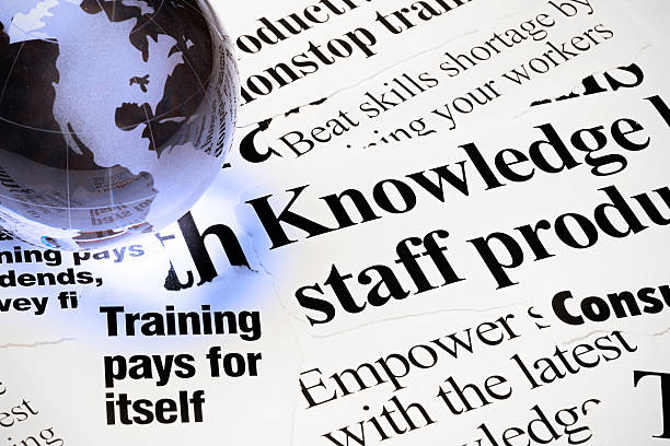 istock Glass world globe on newspaper headlines about staff training 171150551