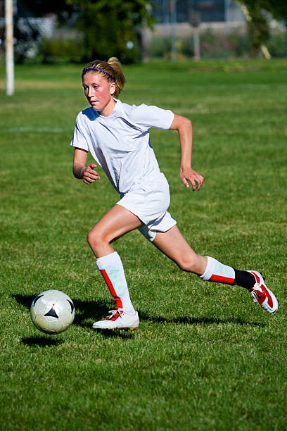 istock Attractive Young Female Soccer Player in Profile Dribble Touch 171150820
