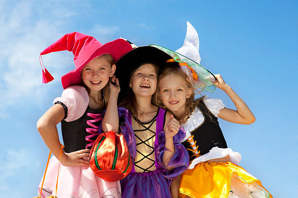 istock Three Cute Little Witches Standing with Bags. 171150981