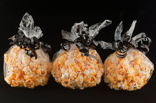 Popcorn balls decorated for Halloween treats.