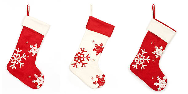 Thress Christmas stockings with shadow on white background