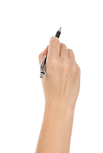 Writing with Ballpoint Pen Right handed person writing with a ballpoint pen. Studio isolated on a white background. Selective focus on the tip on the pen.Please also see: right handed stock pictures, royalty-free photos & images