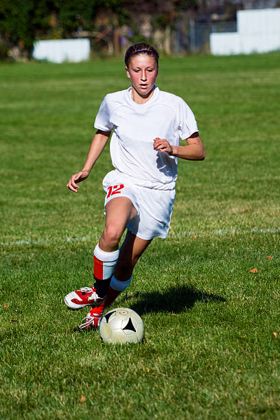 istock Attractive Young Female with Dynamic Soccer Dribble Touch 171151174
