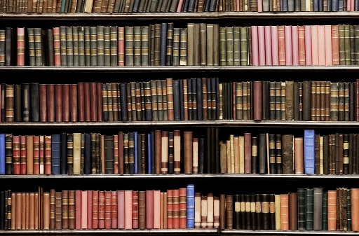 Desaturated colors. Old books in a library