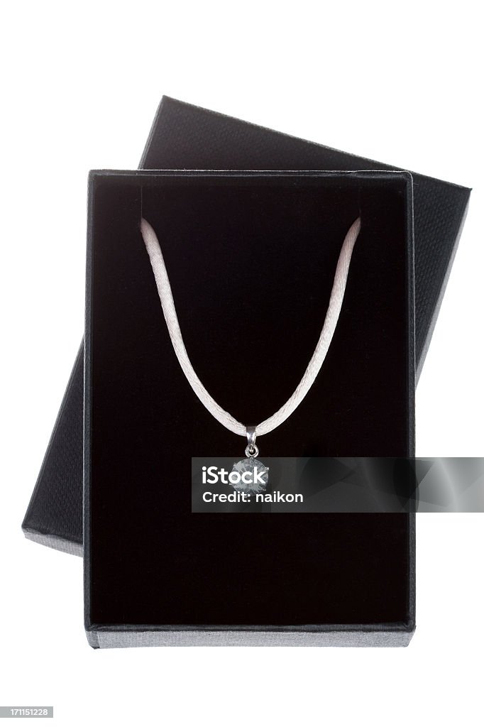 Necklace in a isolated gift box Necklace in an isolated black gift box. Necklace Stock Photo