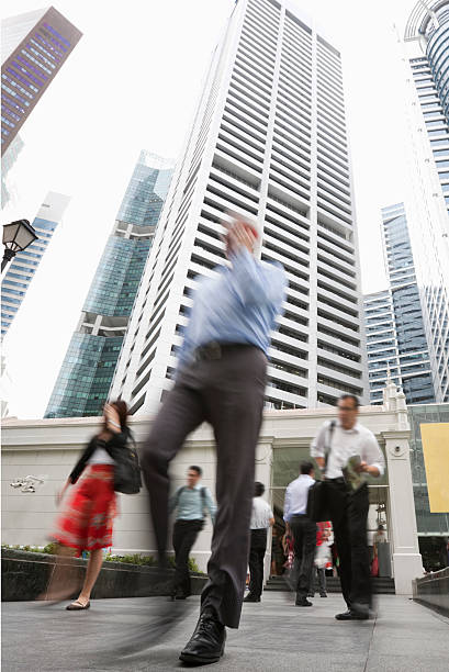 istock Business people walking through Singapore's financial district. 171151611